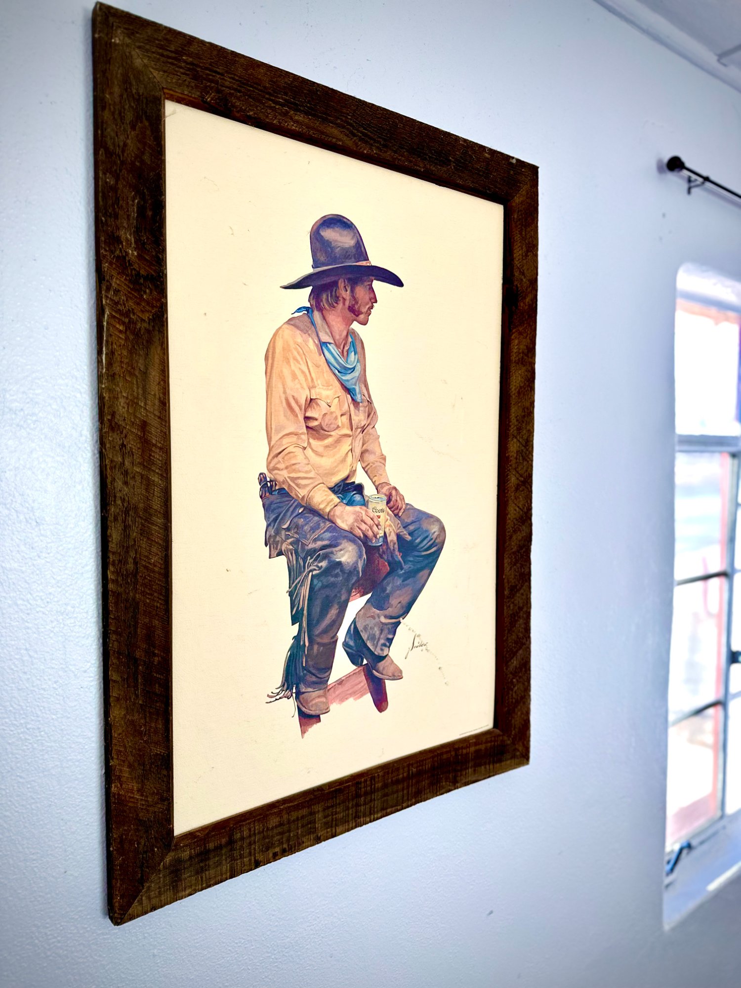 Cowboy art detail with reclaimed wood frame