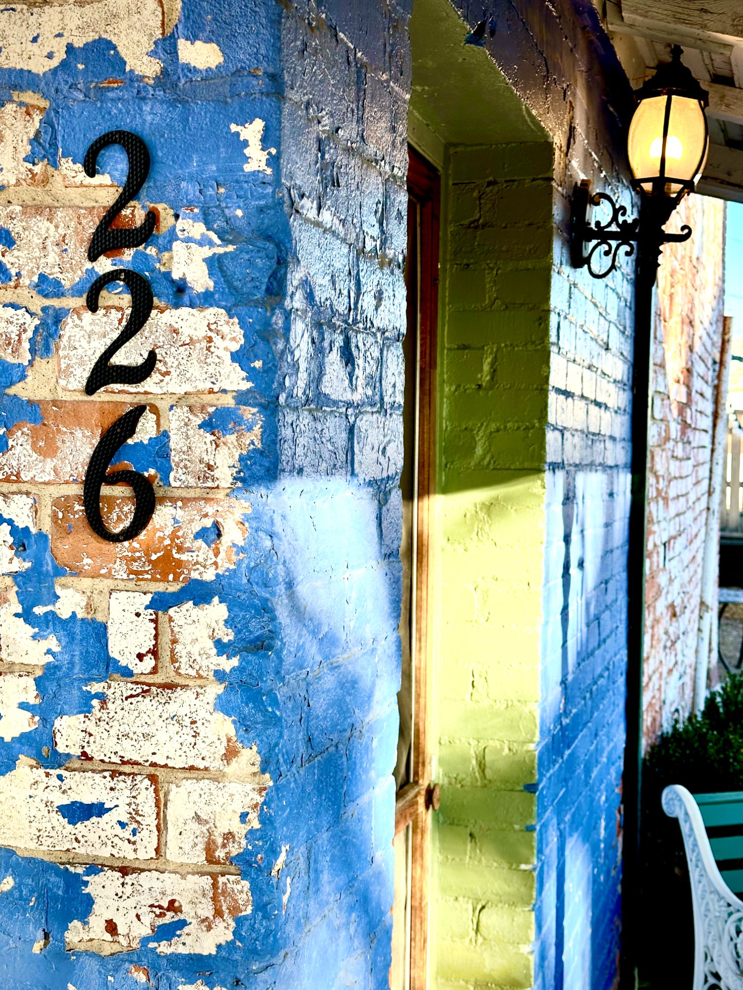 Address 226 detail, peeling blue paint, gas lamp