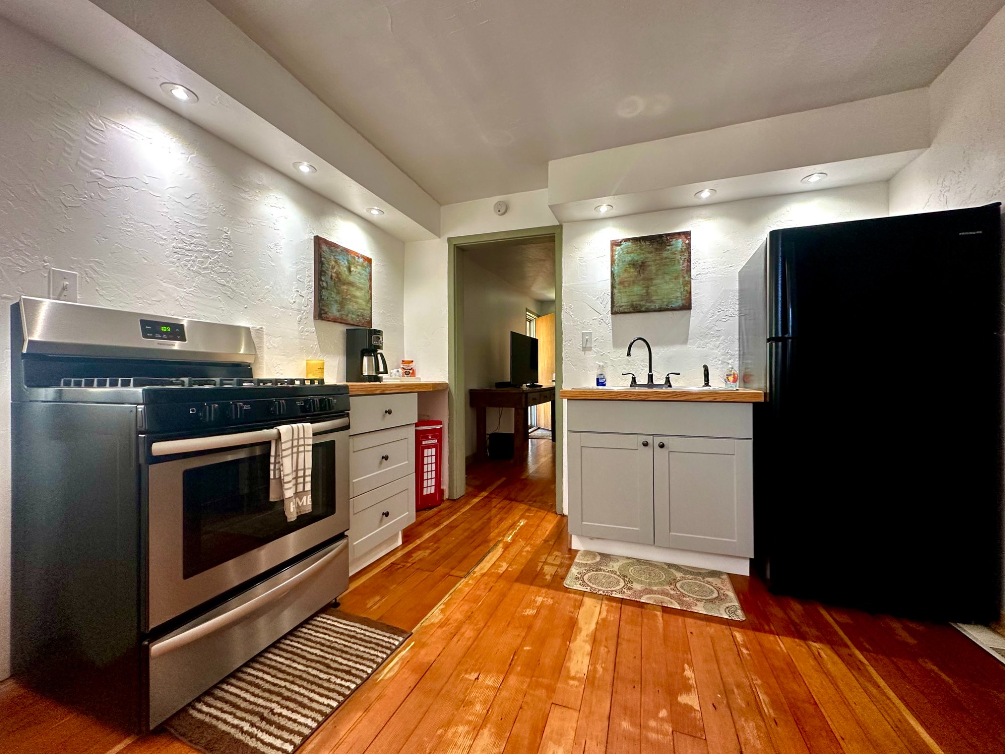 Kitchen with art on walls