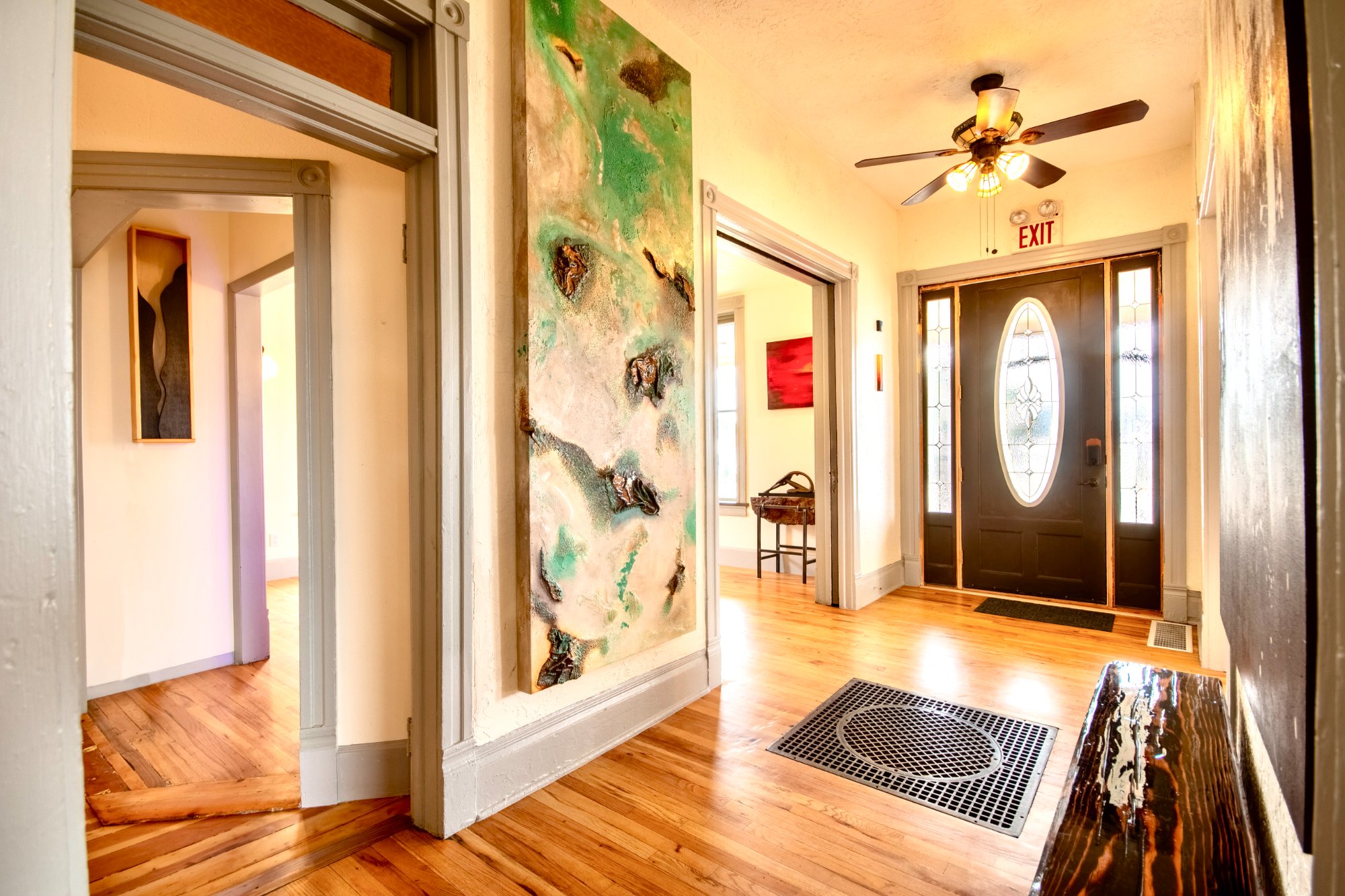 Entry hall with large green painting and original front door