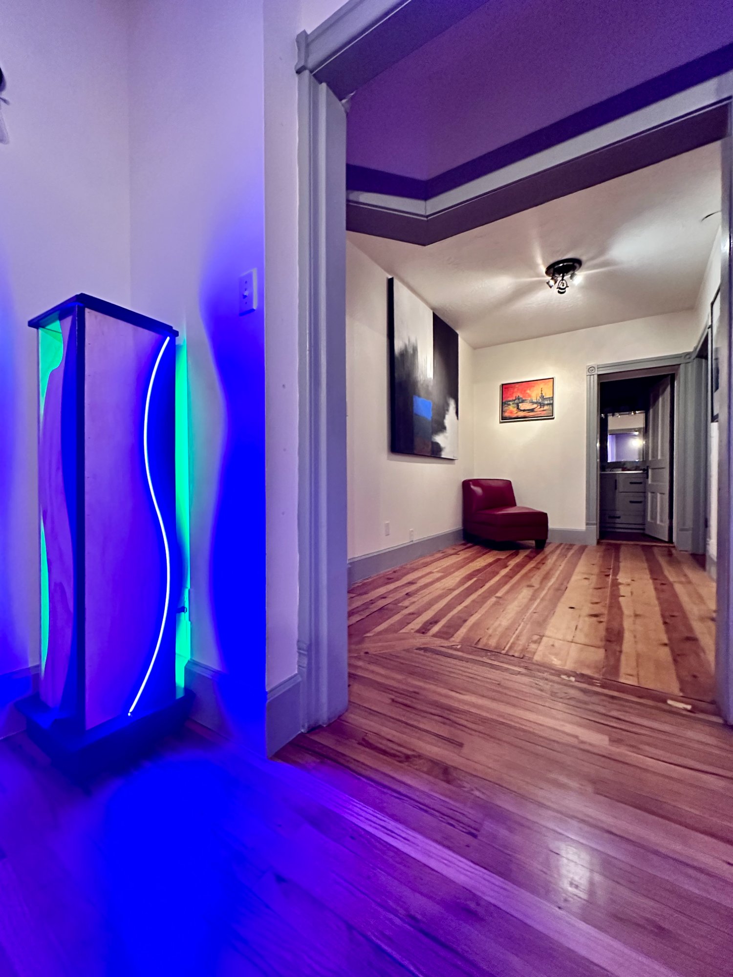 Illuminated sculpture glowing in the hallway